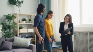 A couple reviews a home they plan to buy with a professional