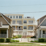 Two houses with similar architecture are next to each other