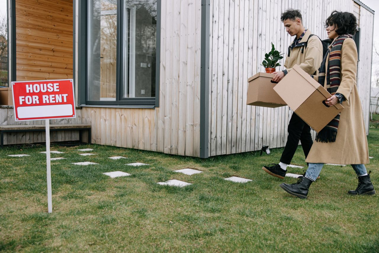 Two college students moving into a rental property